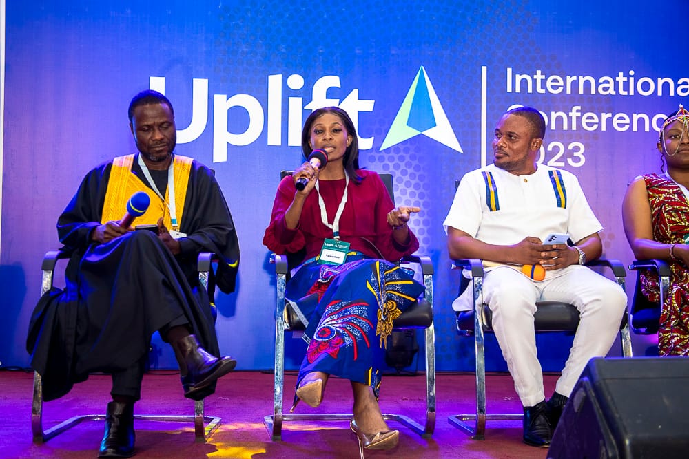 Panel at the Uplift International Conference: speakers and leaders on stage representing UPLIFT Afrika as a wing of COME.